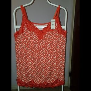 Orange printed tank with lace trim.